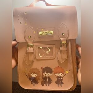 Loungefly Harry Potter dusty rose backpack with Ron, Hermione, and Harry.